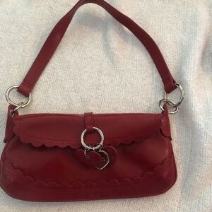 Oxoxo red purse with little hearts on the front, real cute little purse